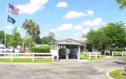 Main entrance showing mailboxes, club house, and office.