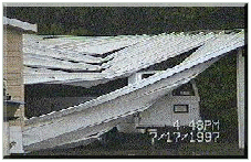 [July 17th, 1997 at Whitney Mobile
Home Park.  Damage to an aluminum
carport caused by the strong downward
winds of a microburst.]