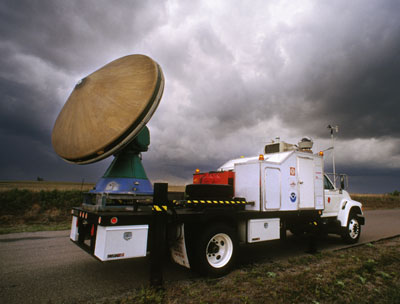 [ Alisa spent two years, from 2001-2002, with the Doppler On Wheels team driving the scout jeep. ]